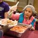 Serving ham, Sasha Lee, age 9, volunteers her Thanksgiving afternoon to serve up a traditional Thanksgiving meal at the Vineyard Church.
Courtney Sacco I AnnArbor.com 